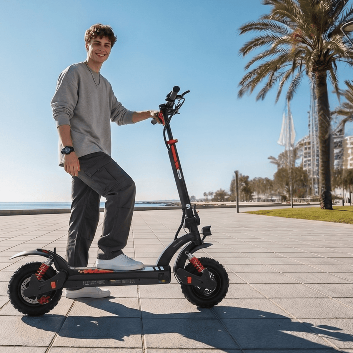 Persona de pie junto al patinete eléctrico iScooter GX3 Pro por un camino peatonal