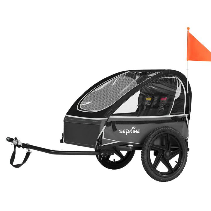 Remolque infantil para bicicleta Smart en negro visto de lado