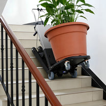 Carretilla eléctrica inteligente para subir escaleras con carga en una escalera