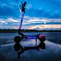 Patinete eléctrico TEVERUN FIGHTER ELEVEN+ V4 en vista frontal en ángulo al atardecer